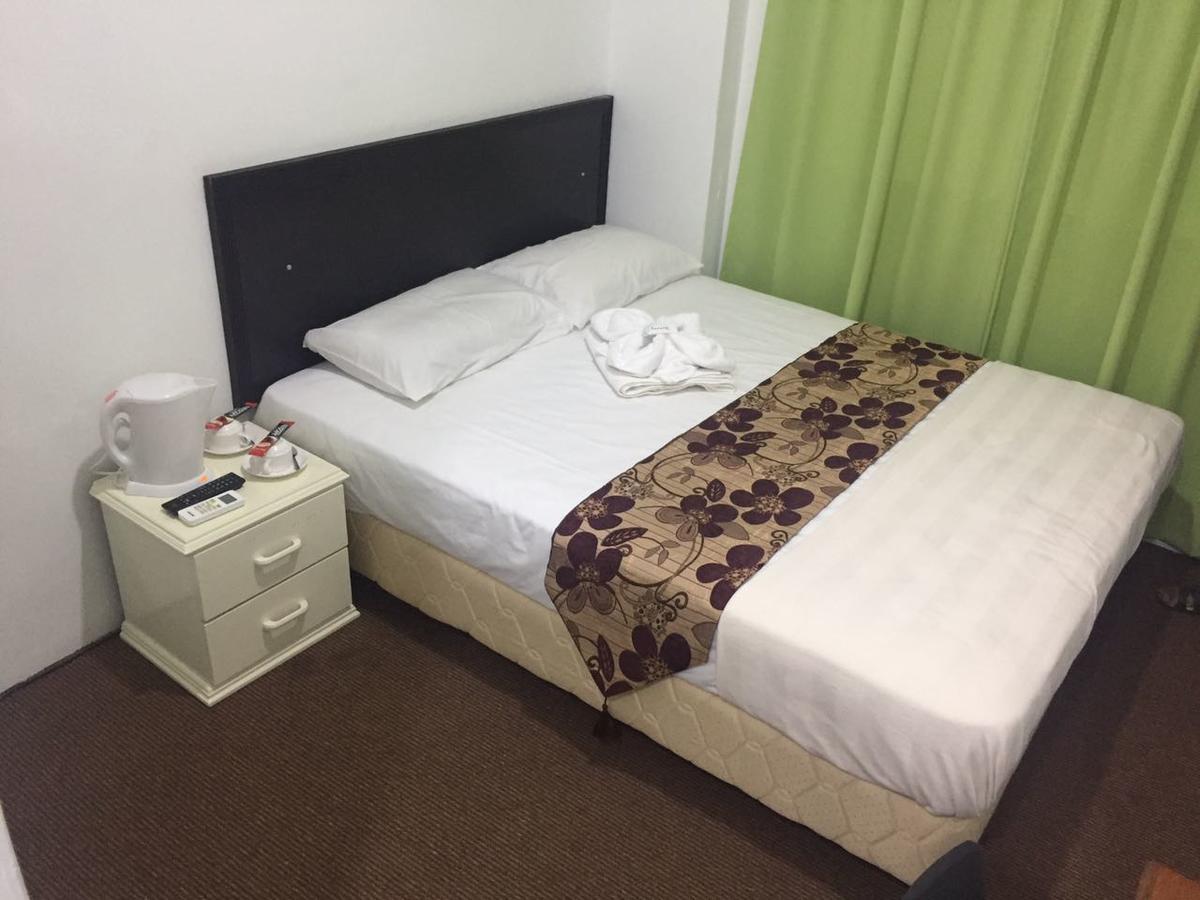 Hotel Singgah Inn Муар Екстериор снимка