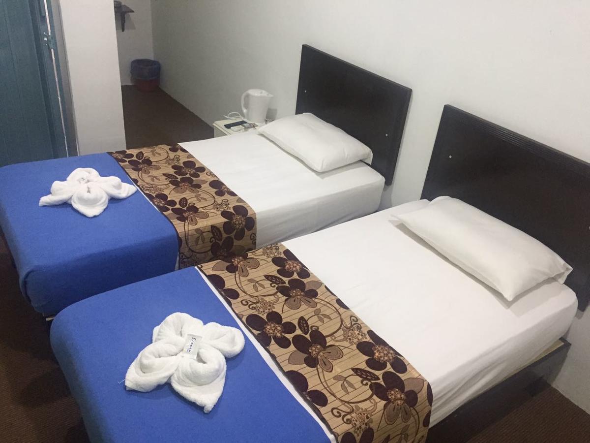 Hotel Singgah Inn Муар Екстериор снимка